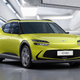 A photo of a yellow Genesis GV60 electric car.